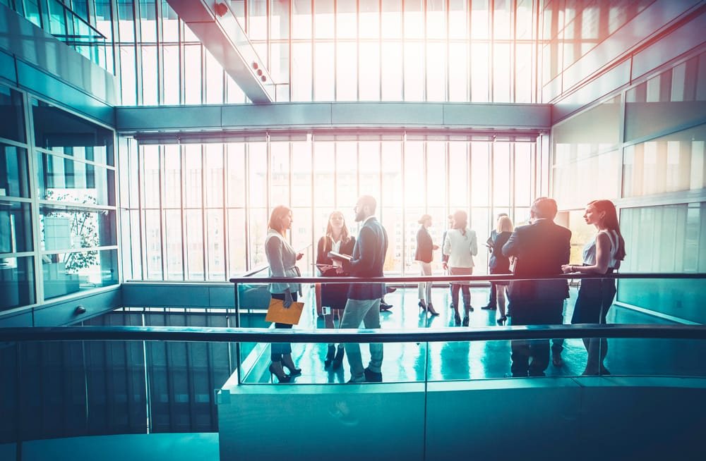 Business teams collaborating in a modern office